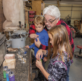 Luke and Emily Faris help their grandfather, Melvin, with creating some of the Badlands Shaving Co. products.