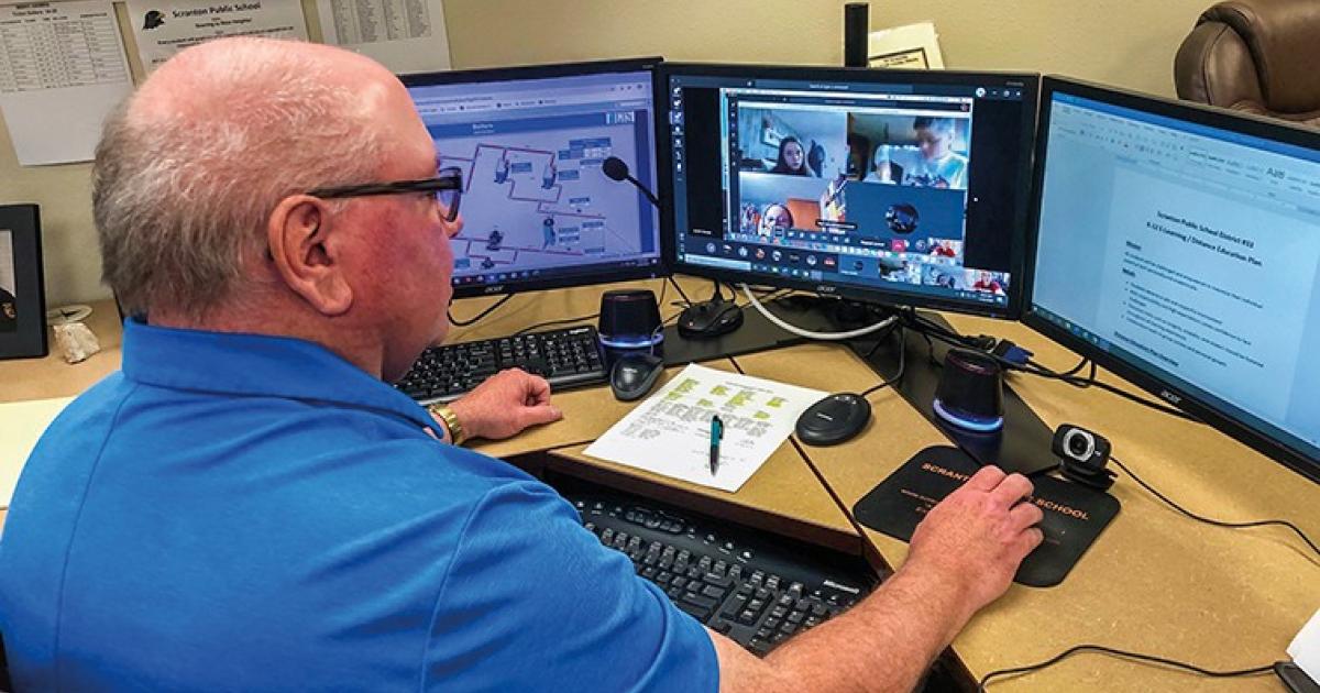 Scranton Public School Superintendent John Pretzer monitors online classrooms since transitioning to web-based learning amid COVID-19 school closures.