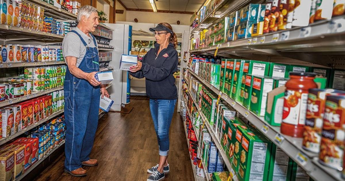 Jason's Super Foods Manager Tracie Thompson helps customer John Mundt in his search for coffee filters in small-town Westhope. Photos by NDAREC/Liza Kessel