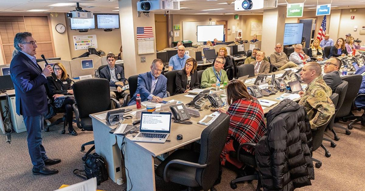 Gov. Doug Burgum speaks with team members during a meeting of the N.D. Joint Information Center, convened to share COVID-19 information with North Dakotans. Photo courtesy N.D. Governor's Office