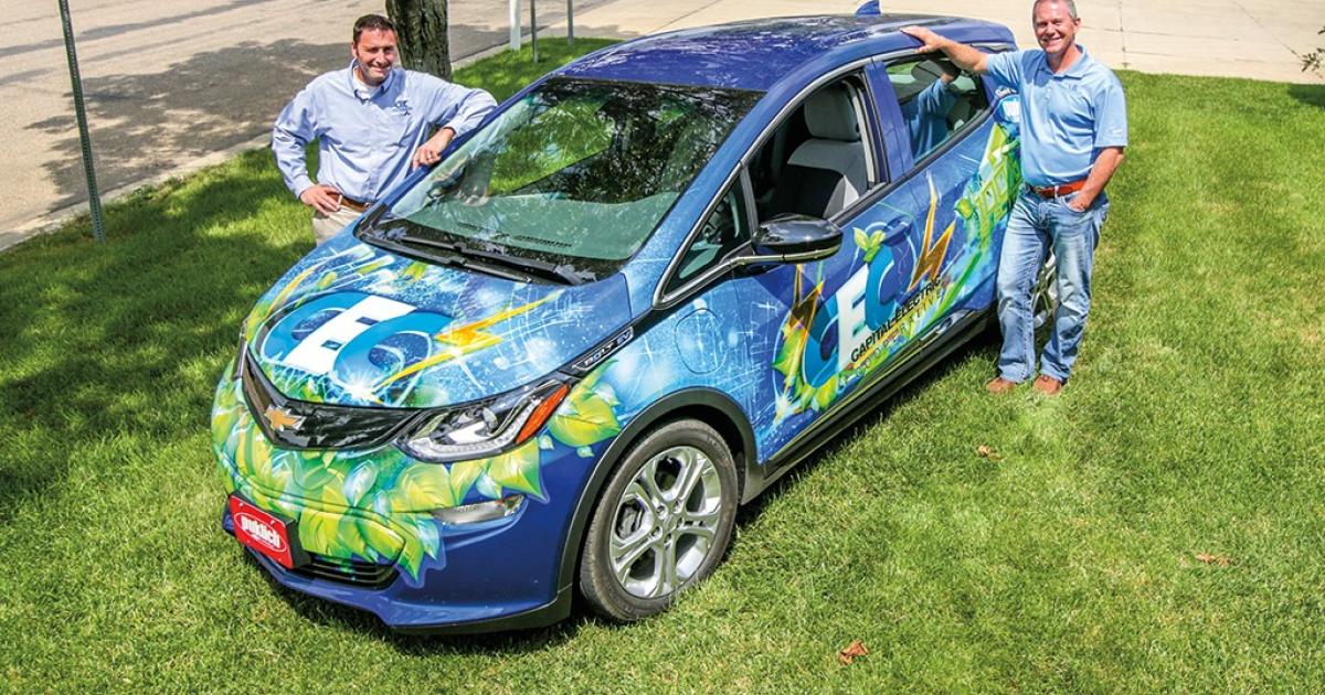 Capital Electric Cooperative's Josh Schaffner (left) and Wes Engbrecht with the cooperative's new Chevy Volt.