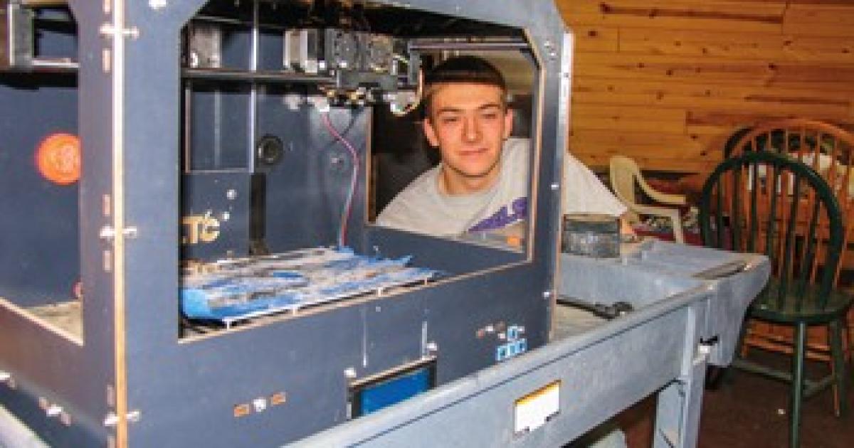 Kurt Muggli peers through his CTC 3-D printer.