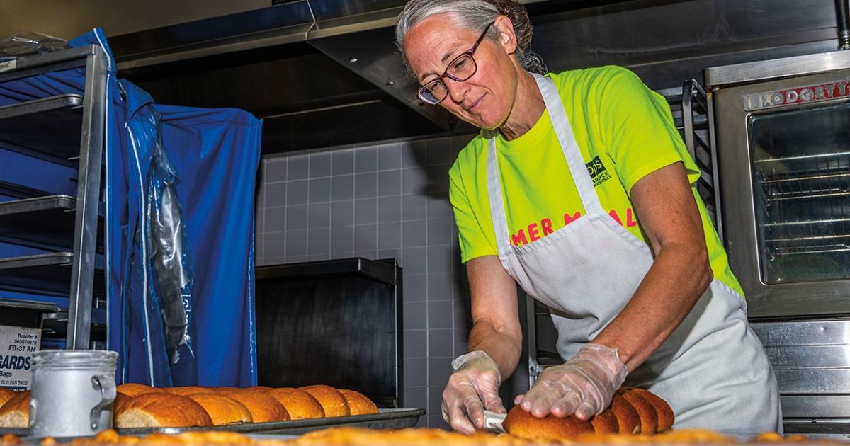 Chris Levorson, head cook at Bismarck High School, prepares buns for a summer meal program that provides no-cost lunches to area kids and community members.