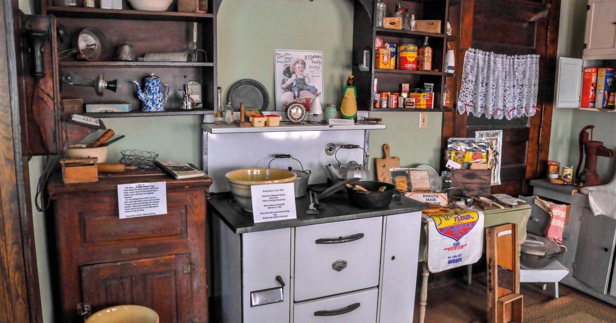 A reassembled early kitchen area (left) and “The Biker Thinker” metal sculpture (right) are among historical and artistic displays at the Mott Gallery.
