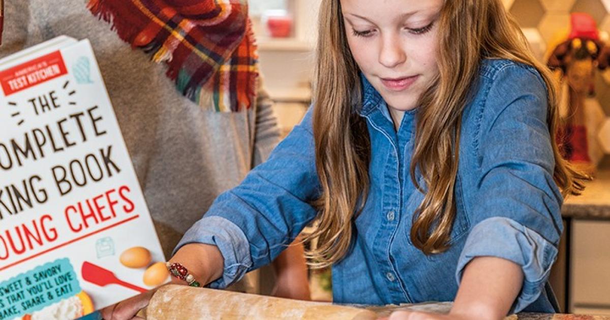 Aftin Boling looks on as her 10-year-old daughter, Addy, gets busy in the kitchen. Photo by NDAREC/Liza Kessel