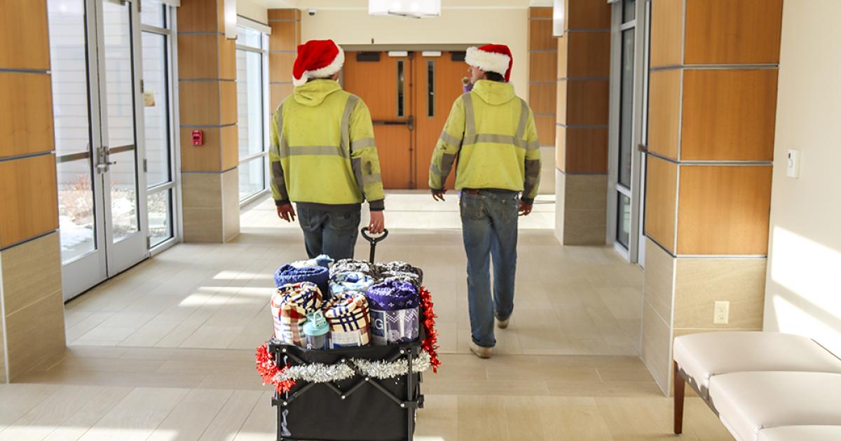 lineworkers deliver blankets to local care facilities