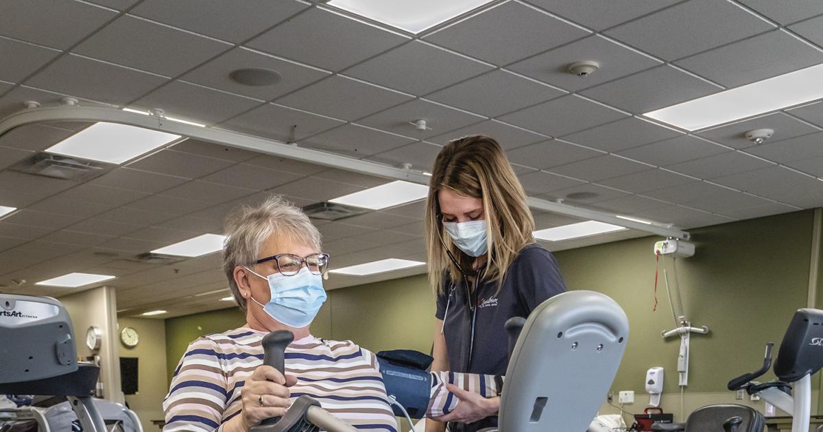 Exercise physiologist Madeline Ranum checks Lori Solberg’s blood pressure during a workout at Jamestown Regional Medical Center. Photo by NDAREC/Liza Kessel