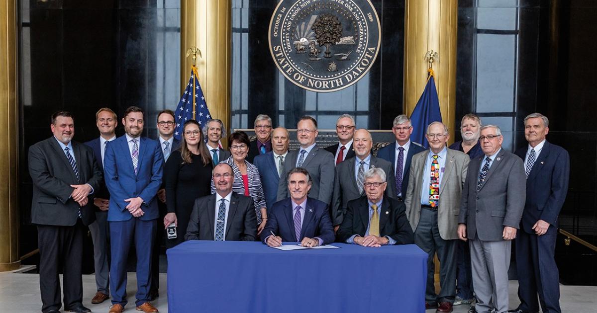 Gov. Doug Burgum signs House Bill 1412 into law. The legislation provides lignite power plant and conversion facility operators five years of immediate tax relief from coal conversion taxes. With the North Dakota lignite industry facing pressures from the federal government and skewed energy market prices, House Bill 1412 will help level the playing field for the lignite industry and make lignite-fueled electricity more competitive on the electric grid. PHOTO BY NDAREC/LIZA KESSEL