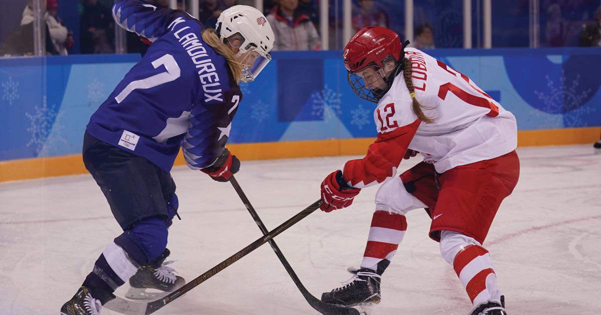 Monique Lamoureux-Morando battles for the puck during the 2018 Olympics in PyeongChang, Korea. Stock photos