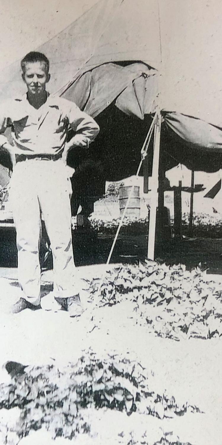 A young Bob Hunter is shown outside his U.S. Army barber tent, where he cut hair and gave shaves with straight-edged razors to servicemen, on the island of Ie Shima, off the coast of Okinawa, Japan, during WWII. Courtesy Photo